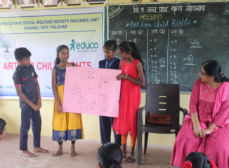 Students presenting Warli murals